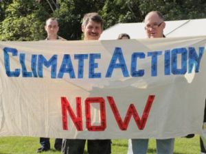 Activists with sign: "climate action now"