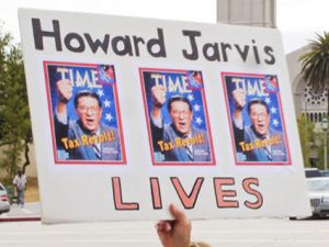 a sign that says "Howard Jarvis lives"