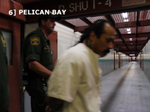 Pelican Bay prisoner is escorted by guards.