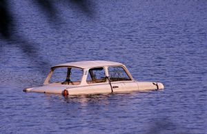 Car in a pond.