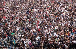 A densely packed crowd of people.