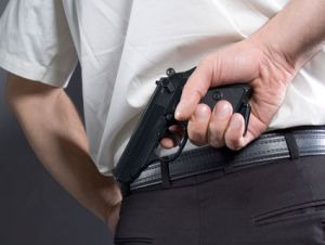 gun behind back