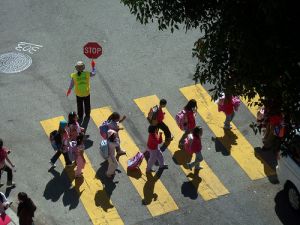 kids crossing with guard