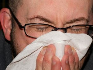 man sneezing