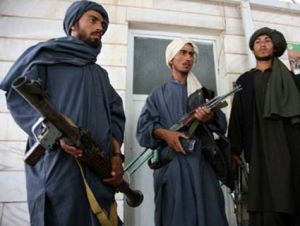 former Taliban insurgents with weapons