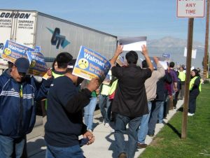 Warehouse workers picketing outside Schneider facilities