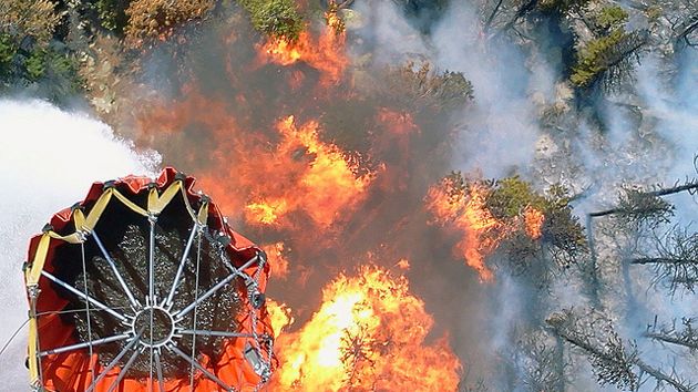 The National Guard drops water onto the High Park fire approximately 15 miles we