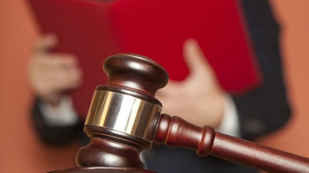 a gavel and a judge in the background