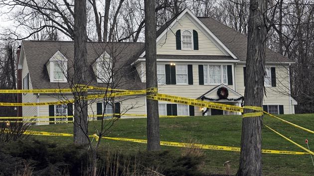 A house with police tape in front of it