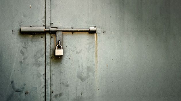 a rusty lock on a door