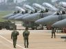 soldiers in front of planes