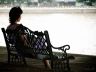 woman sitting alone on a bench
