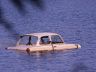 Car in a pond.