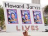 a sign that says "Howard Jarvis lives"