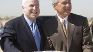 John McCain and George W. Bush with cake