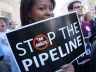 A woman protests the Keystone XL pipeline at a rally in Washington, DC, on Octob