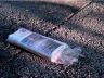 A newspaper on the sidewalk
