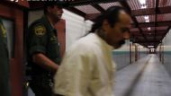 Pelican Bay prisoner is escorted by guards.