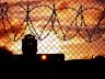 prison barbed wire sunset